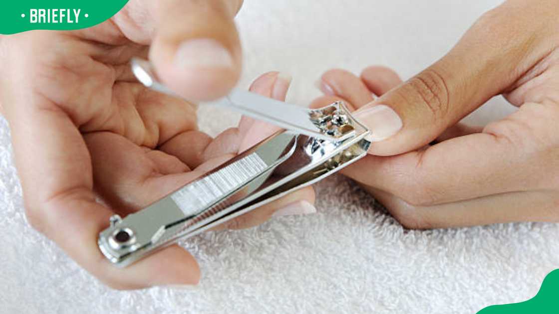 A person trimming nails A person trimming nails