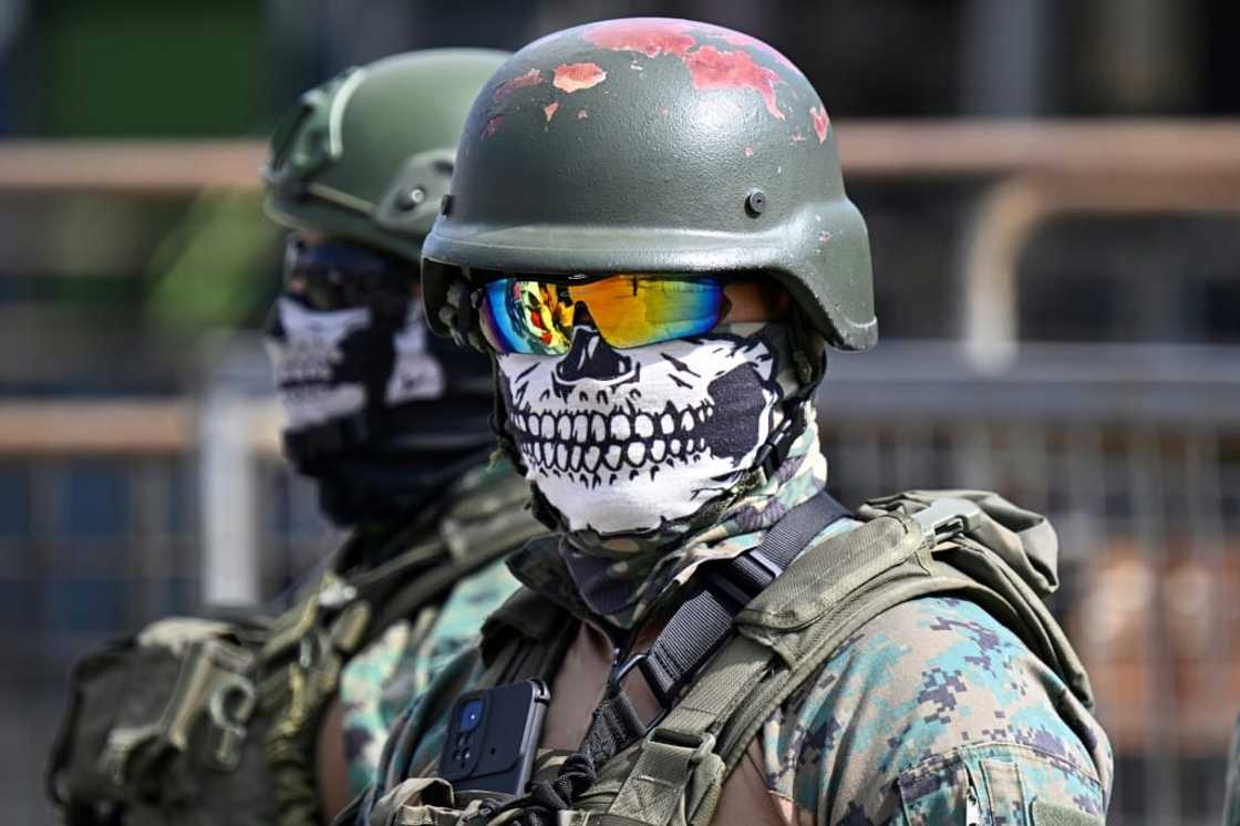 Ecuadoran soldiers guard the perimeter of the Guayas 1 prison amid disturbances there on November 4, 2022