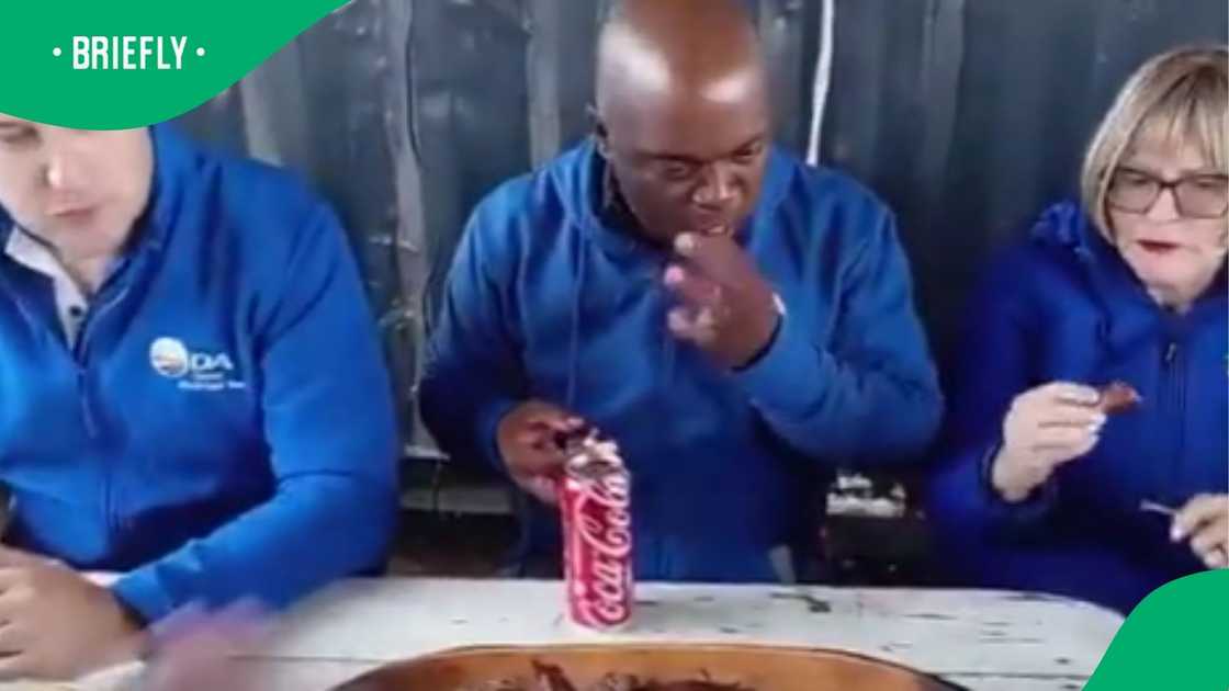 The image captured them wearing DA jerseys together with a voter The image captured them wearing DA jerseys together with a voter