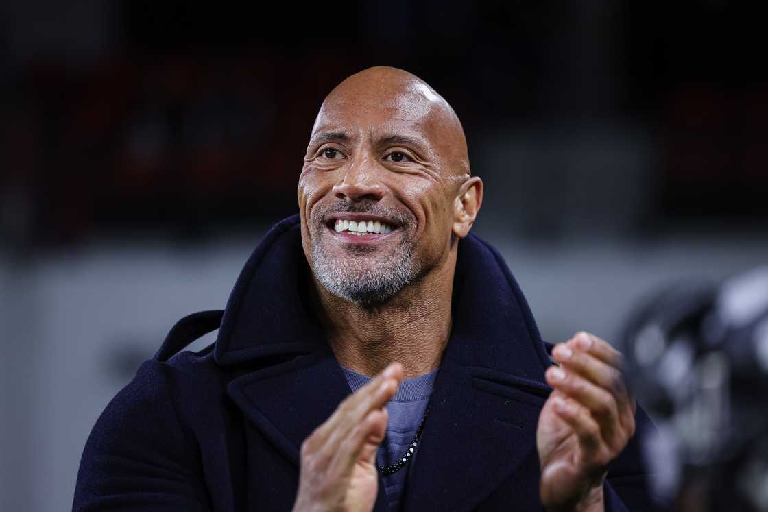 Dwayne Johnson reacts on the sideline during the first half of the XFL game between the DC Defenders and the Seattle Sea Dragons at Audi Field in Washington, DC