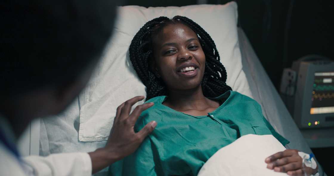 A man gives good news to a female patient. A man gives good news to a female patient.