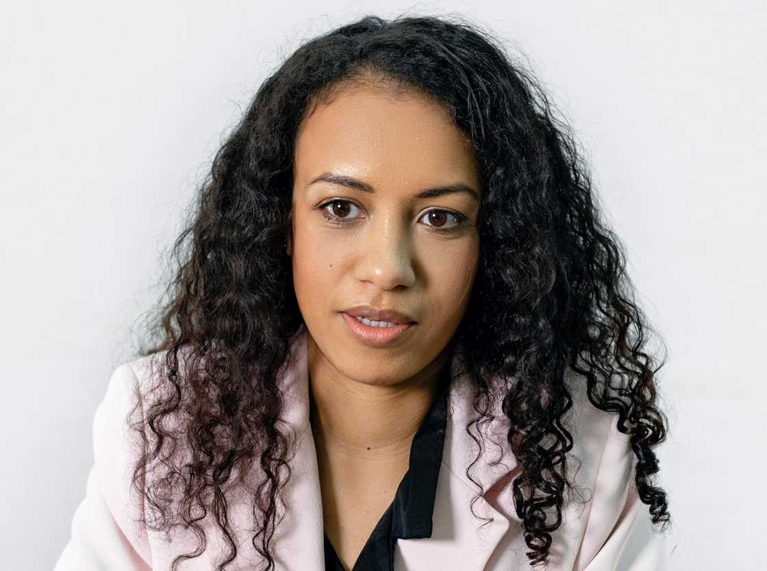 A woman facing the camera against a plain white background.