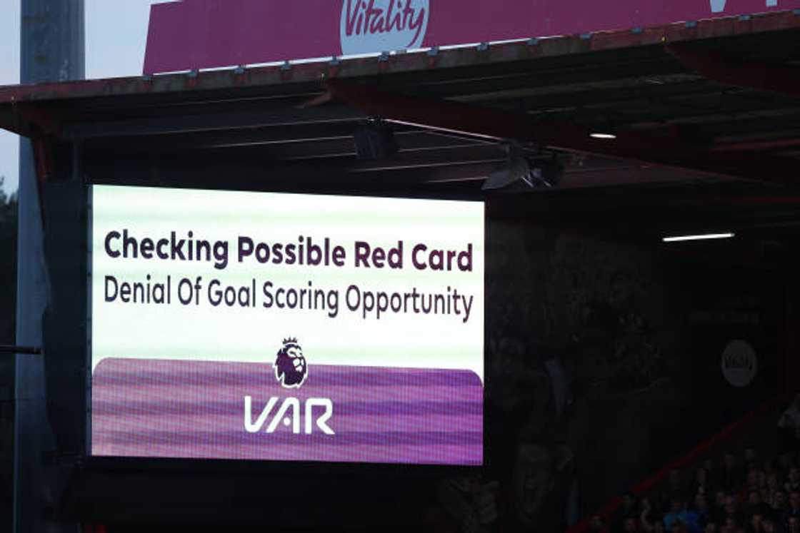 The big screen showing VAR checking a possible red card