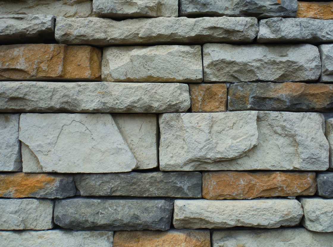 Gray and brown concrete rrick wall Gray and brown concrete rrick wall