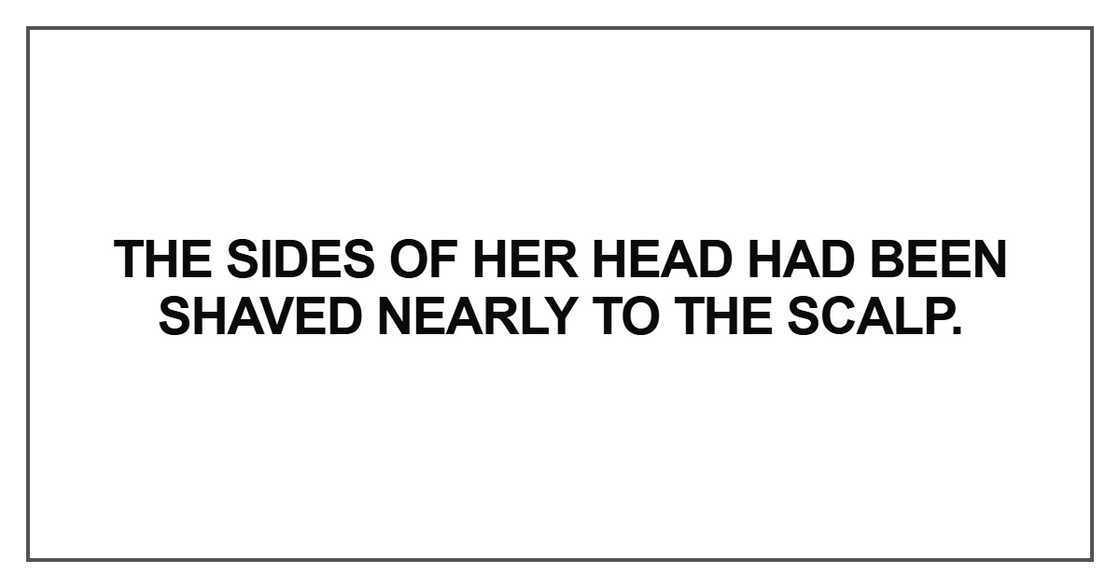 The sides of her head had been shaved nearly to the scalp The sides of her head had been shaved nearly to the scalp
