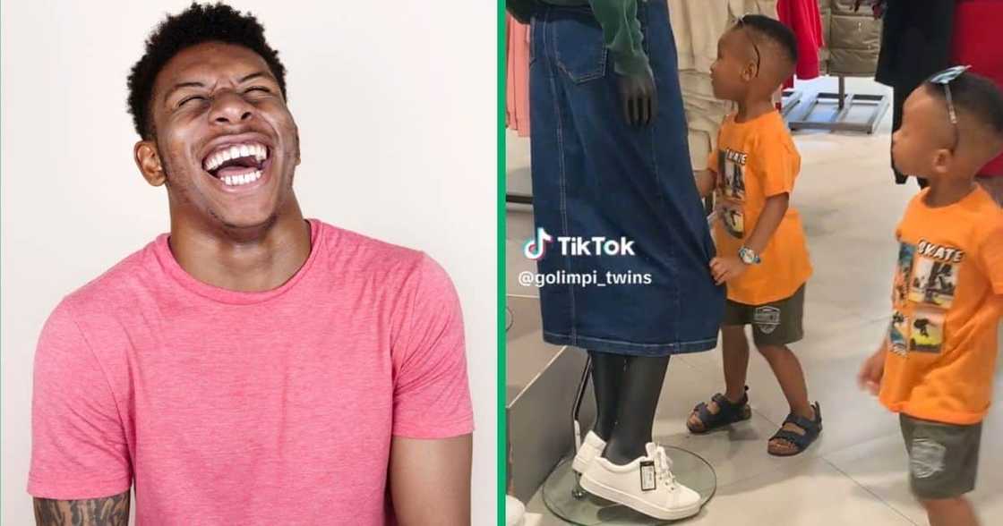 Two little boys were fascinated by a mannequin at a clothing store Two little boys were fascinated by a mannequin at a clothing store