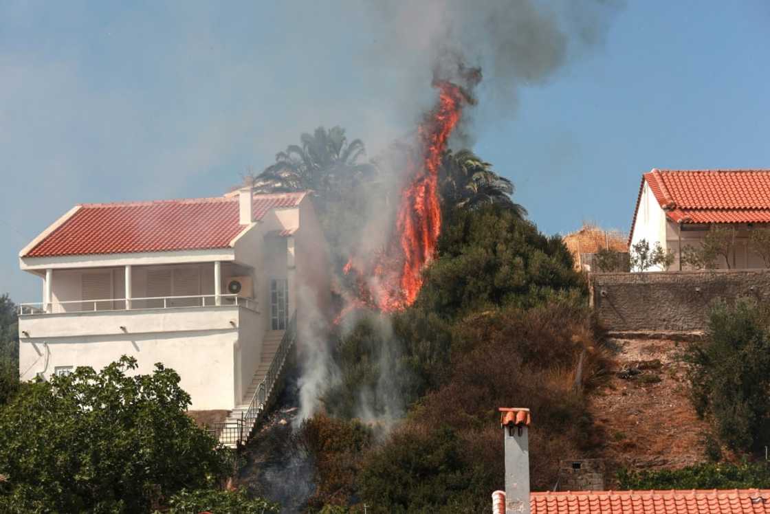 Fires raged in the north, south and east of Greece including on the island of Lesbos