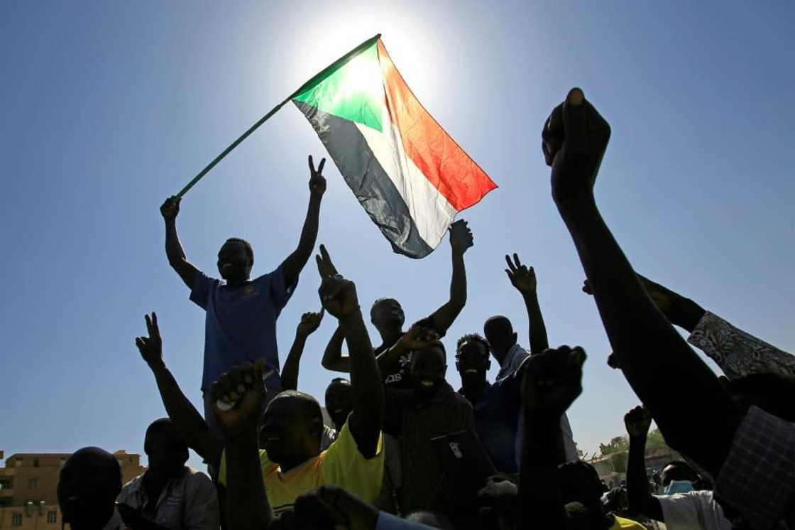 Demonstrators from Sudan's Nuba peoples march in the capital Khartoum on Wednesday to protest against recent deadly inter-ethnic violence in their southern home region Demonstrators from Sudan's Nuba peoples march in the capital Khartoum on Wednesday to protest against recent deadly inter-ethnic violence in their southern home region