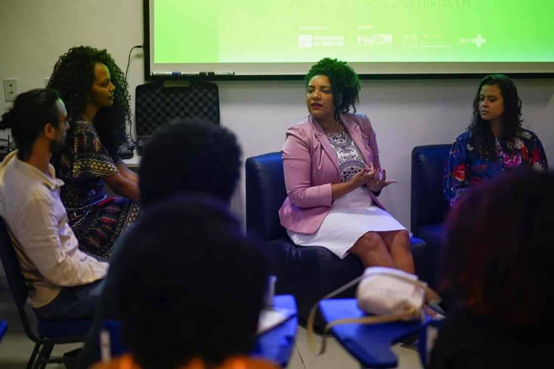 Rio de Janeiro state congresswoman and re-election candidate Renata Souza (C), of the Socialism and Freedom Party (PSOL), takes part in a meeting at the Favela Observatory Center of Mare favela, in Rio de Janeiro, Brazil, on September 02, 2022 Rio de Janeiro state congresswoman and re-election candidate Renata Souza (C), of the Socialism and Freedom Party (PSOL), takes part in a meeting at the Favela Observatory Center of Mare favela, in Rio de Janeiro, Brazil, on September 02, 2022