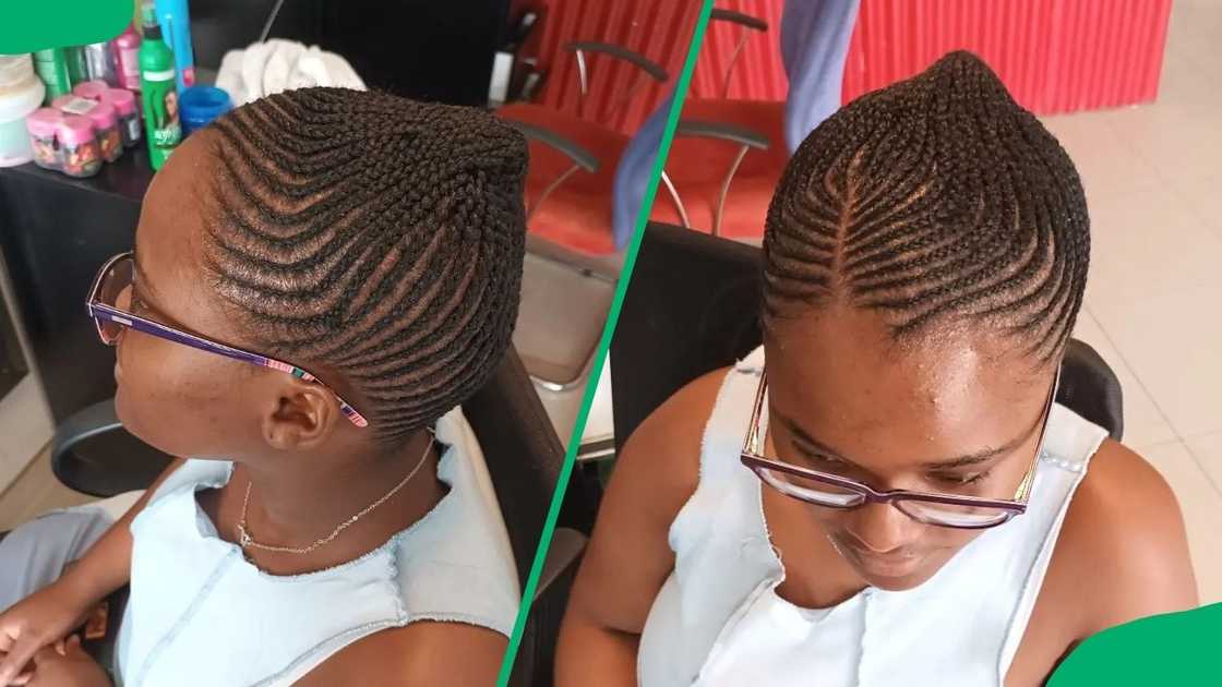A woman with sleek straight-up cornrows A woman with sleek straight-up cornrows