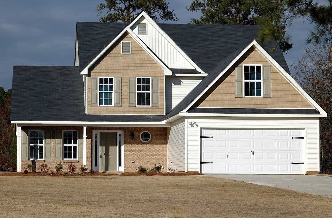 A beautiful home with a white garage A beautiful home with a white garage