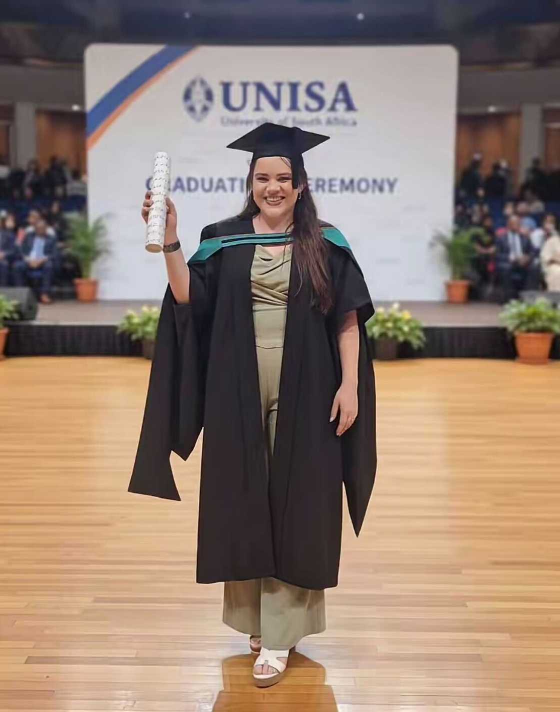 A graduate’s triumphant moment came as she walked the stage in a heartfelt ceremony, after the 2020 COVID delay. A graduate’s triumphant moment came as she walked the stage in a heartfelt ceremony, after the 2020 COVID delay.