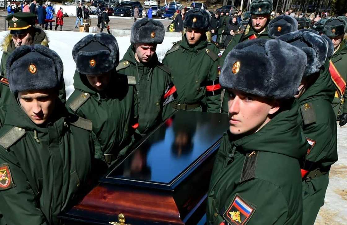 Soldiers carry the coffin of 20-year-old Russian serviceman Nikita Avrov, during his funeral at a church in Luga, some 150 kilometers south of Saint Petersburg, on April 11, 2022 Soldiers carry the coffin of 20-year-old Russian serviceman Nikita Avrov, during his funeral at a church in Luga, some 150 kilometers south of Saint Petersburg, on April 11, 2022