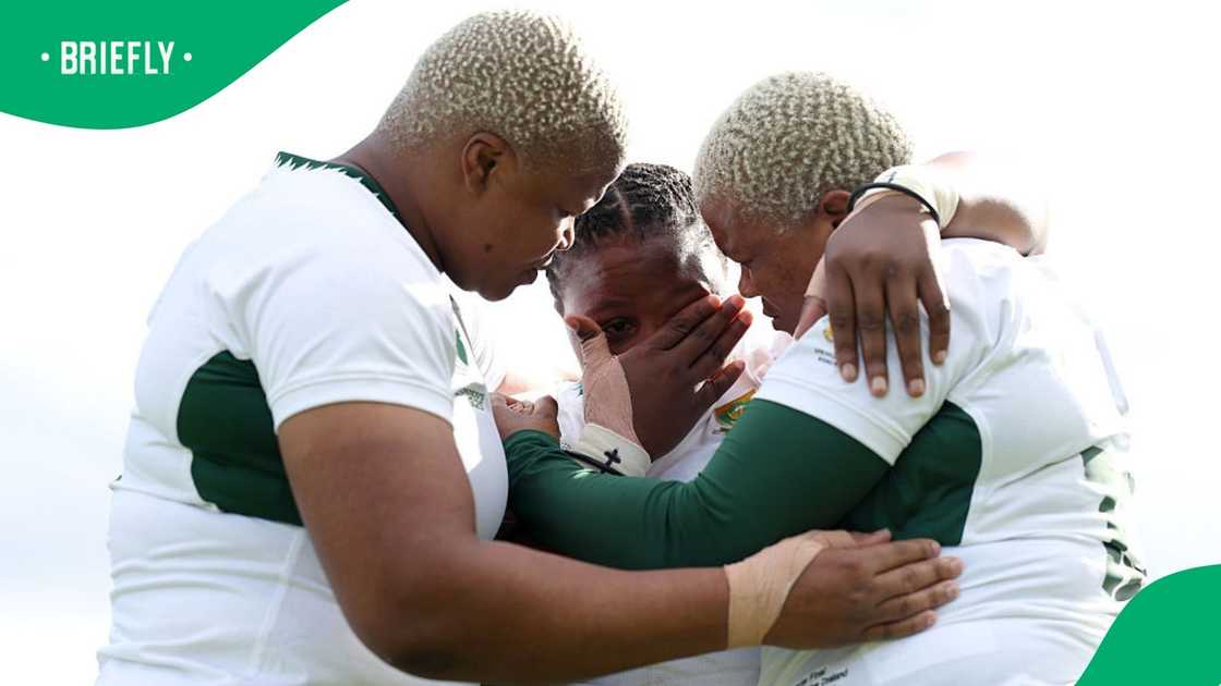 Members of the Springbok Women comfort each other after their major loss against New Zealand's Black Ferns. Members of the Springbok Women comfort each other after their major loss against New Zealand's Black Ferns.