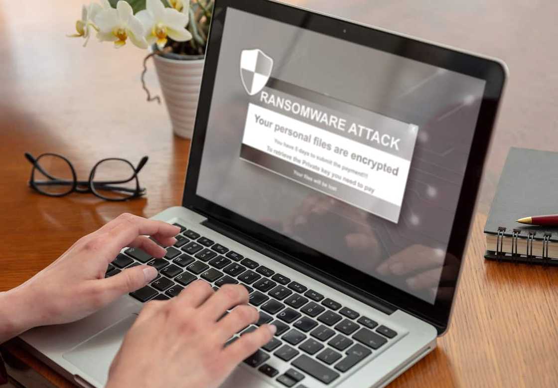 Cybersecurity attack message on a laptop screen Cybersecurity attack message on a laptop screen