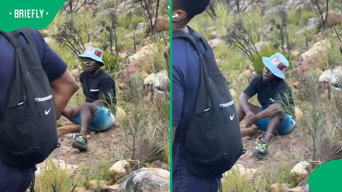 A man sat on the ground as he caught his breath after an intense hike in Cape Town. A man sat on the ground as he caught his breath after an intense hike in Cape Town.