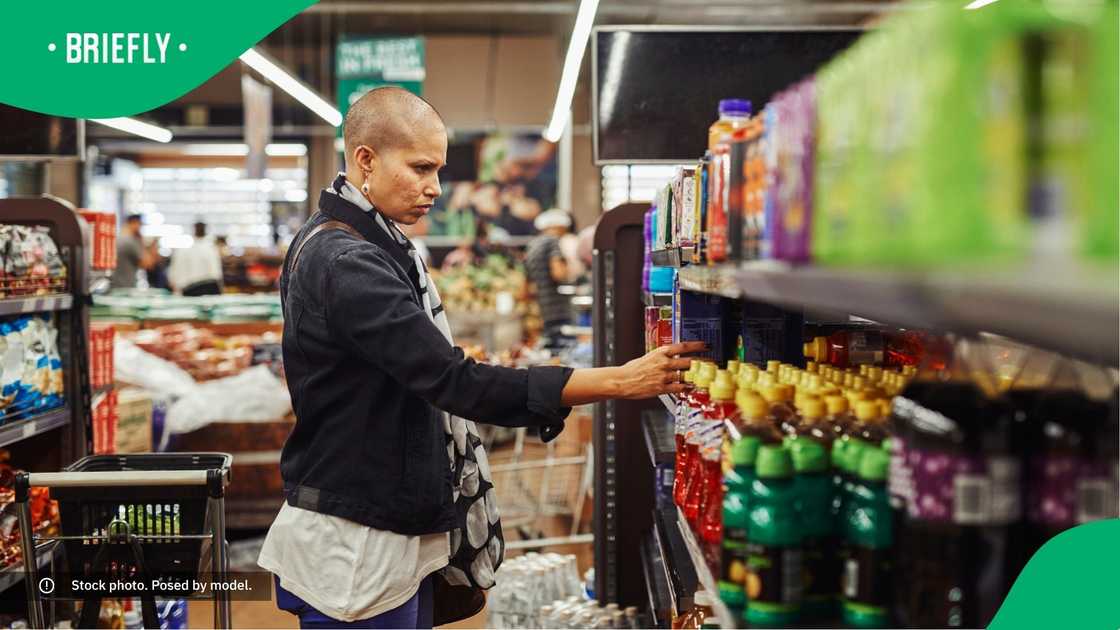 A woman shopping at a supermarket. A woman shopping at a supermarket.
