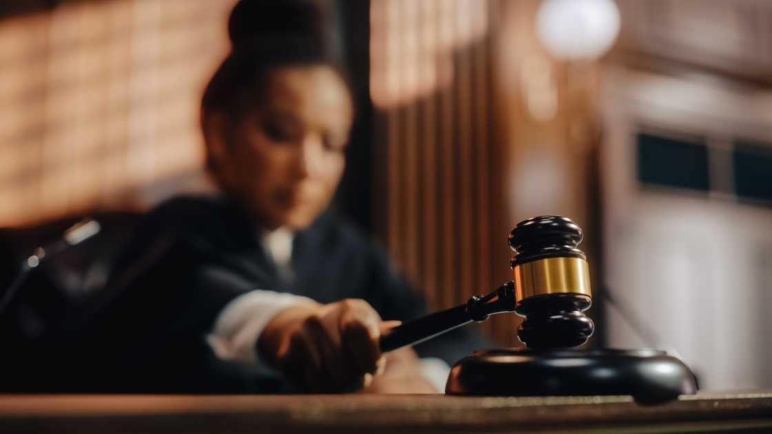 An honourable female judge pronouncing a sentence. An honourable female judge pronouncing a sentence.
