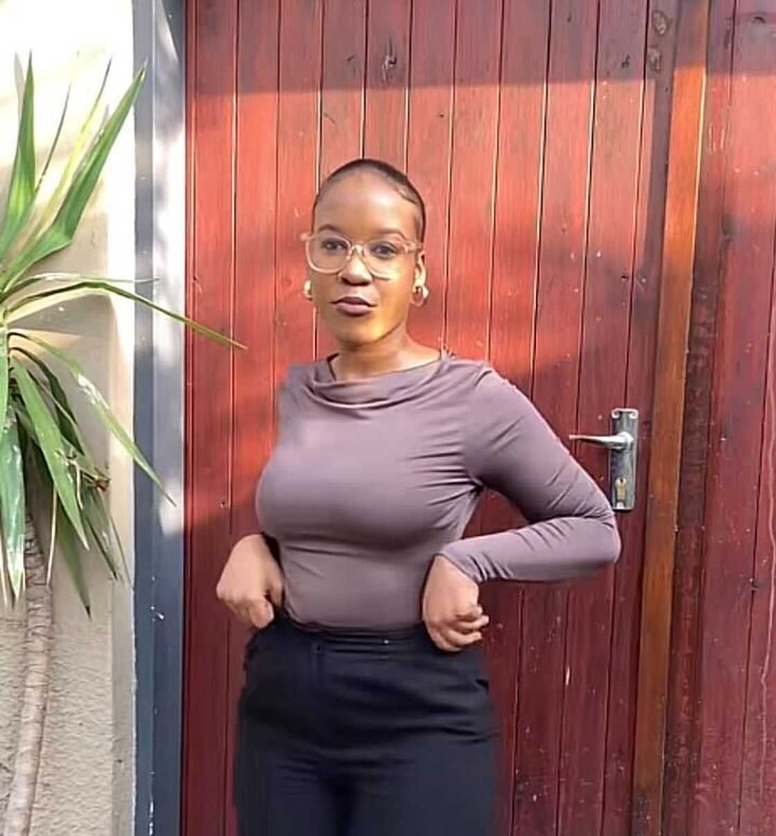 A beauty and fashion vlogger posed in a TikTok video while creating content. A beauty and fashion vlogger posed in a TikTok video while creating content.