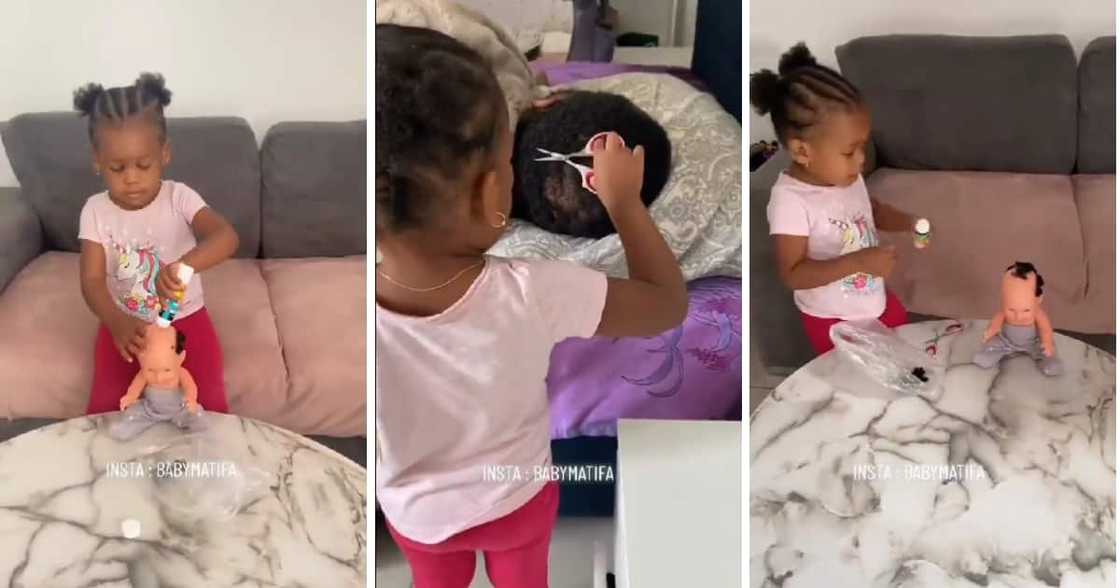 A small kid put real hair on her bald baby doll. A small kid put real hair on her bald baby doll.