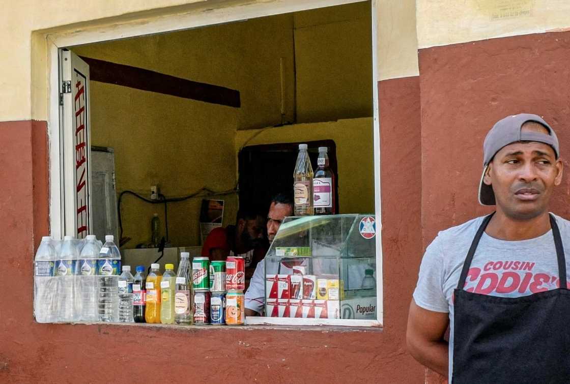 Cubans can extract dollars from the bank but in limited quantities, meaning that black market dealers can charge a premium Cubans can extract dollars from the bank but in limited quantities, meaning that black market dealers can charge a premium