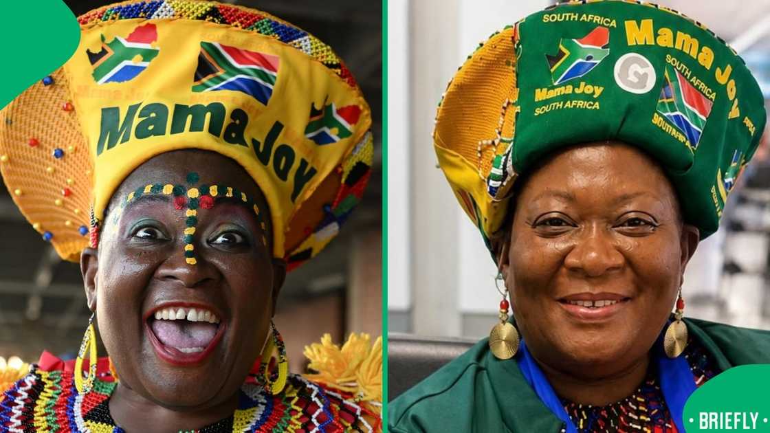 Dressed in colorful traditional attire, Mama Joy stood cheerfully against a plain background for a studio portrait