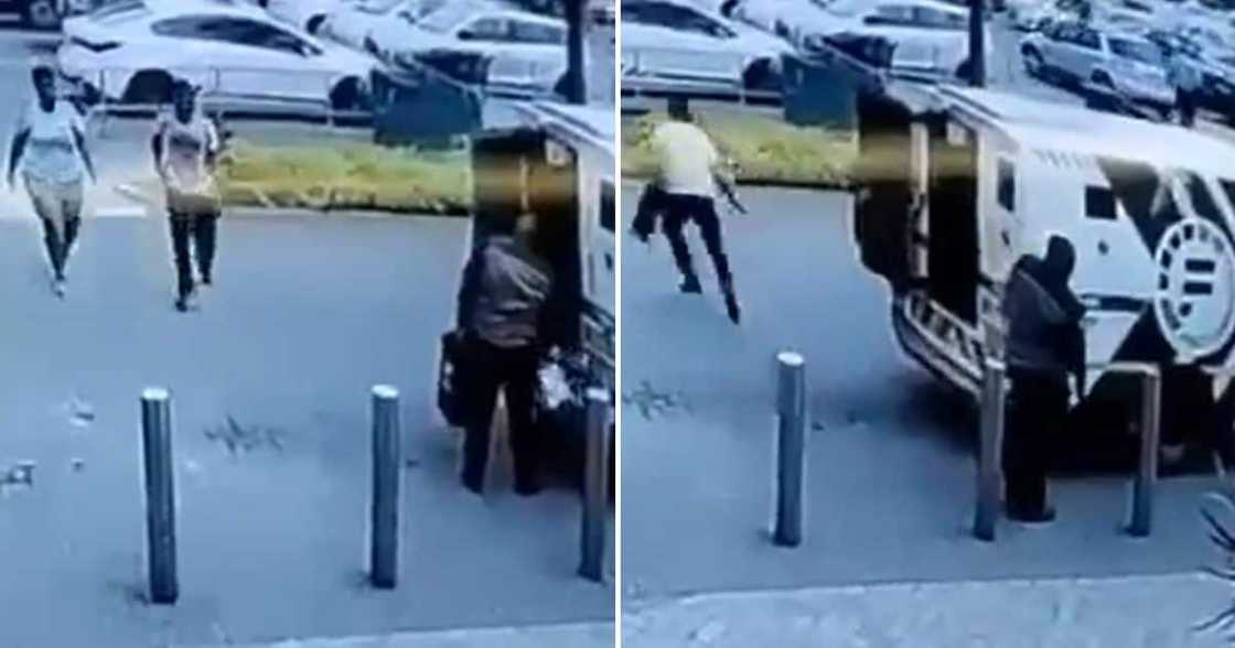 armed man grabbing money box armed man grabbing money box