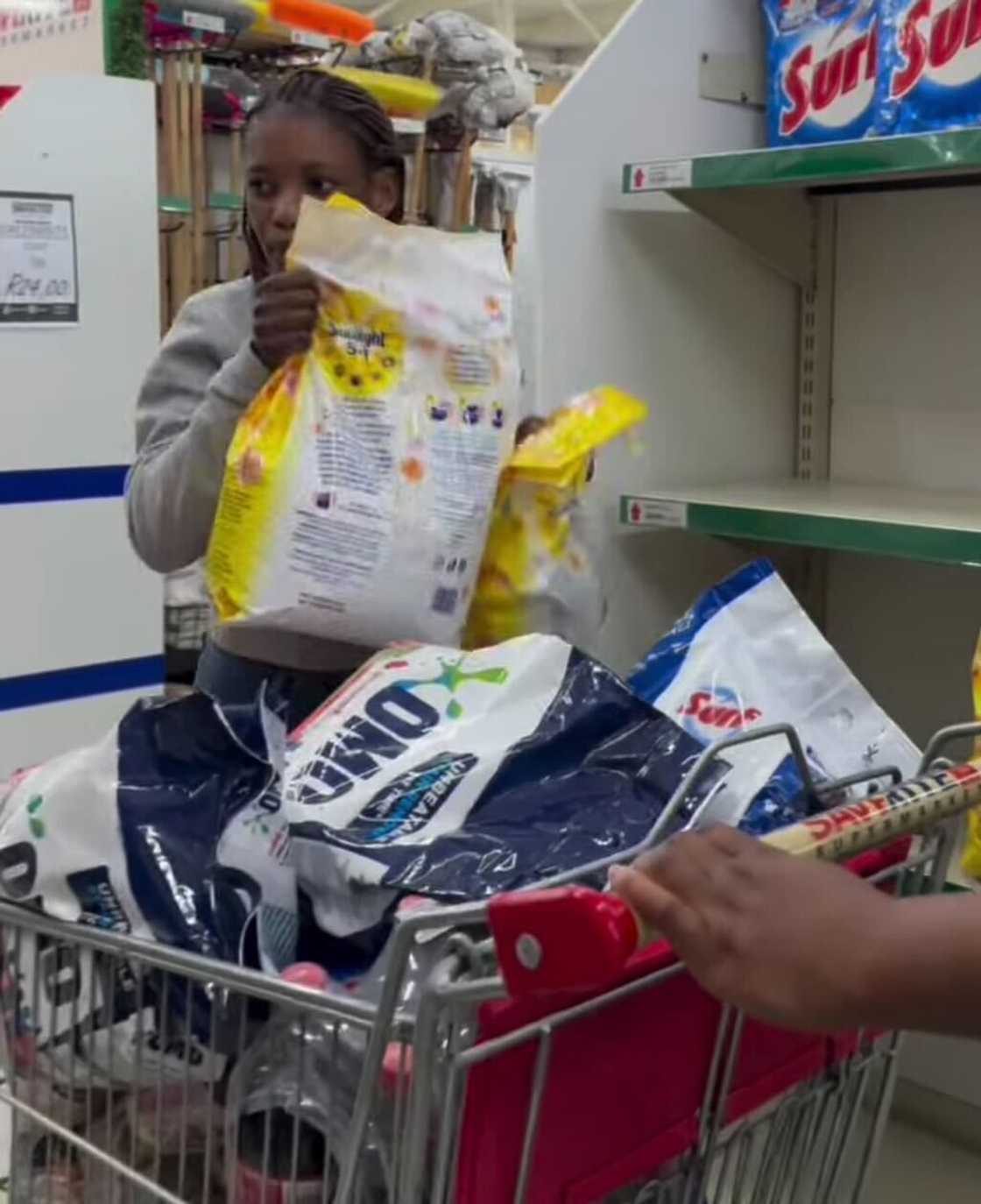 A woman in South Africa took part in the trolley dash and quickly scooped up all the household necessities. A woman in South Africa took part in the trolley dash and quickly scooped up all the household necessities.
