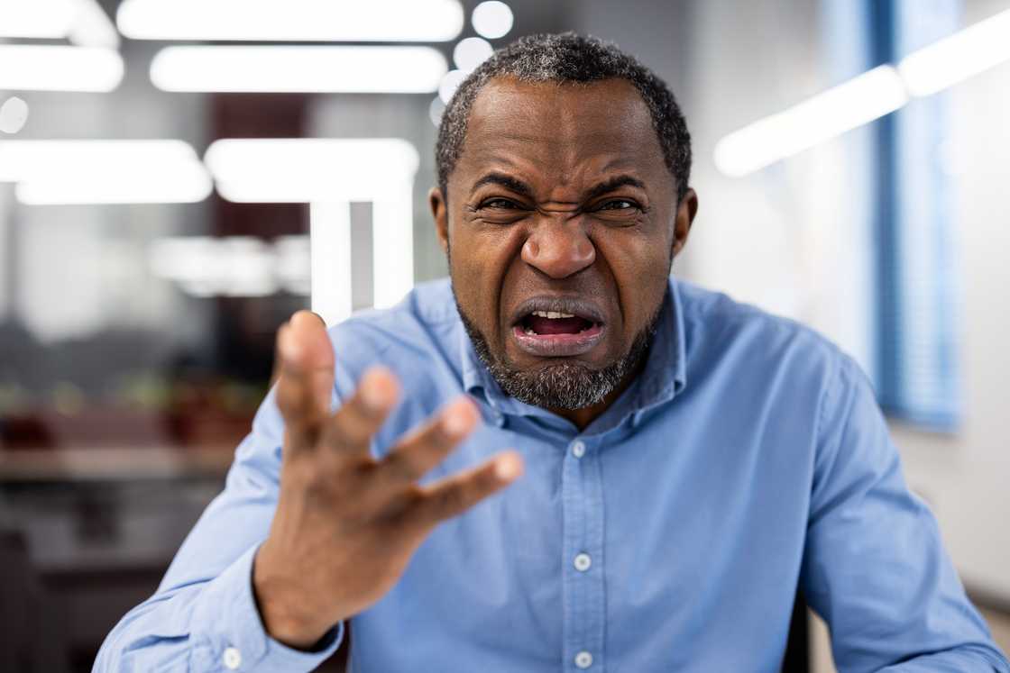 angry senior man shouting pointing fingers