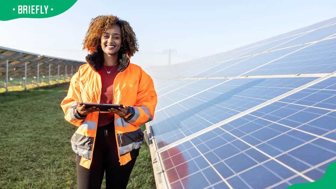A female technician in reflective clothing A female technician in reflective clothing