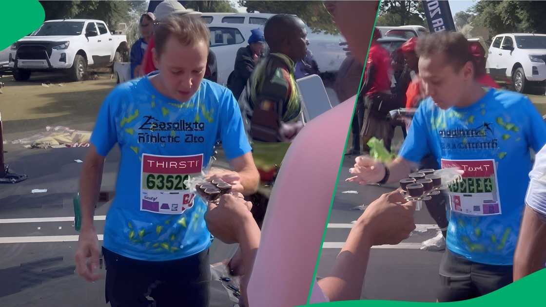 Comrades Marathon athtlete takes swig during race Comrades Marathon athtlete takes swig during race