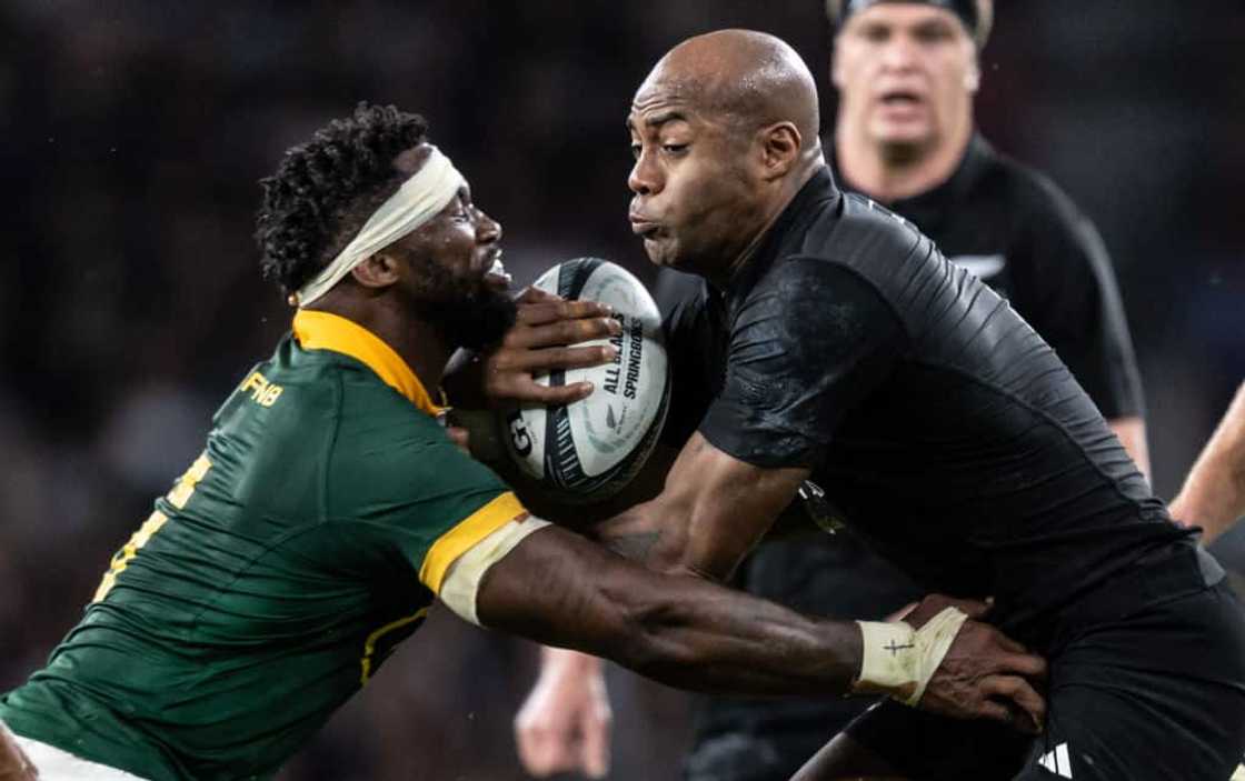 South Africa's Siya Kolisi tackles Mark Telea of New Zealand at the Summer International match between New Zealand All Blacks v South Africa at Twickenham Stadium on August 25, 2023 in London.