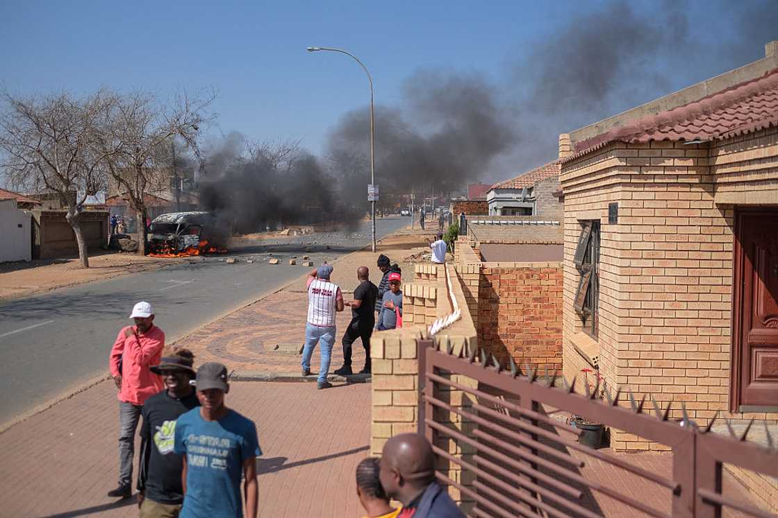 A taix was torched allegedly by angry community members in Pimville, Soweto