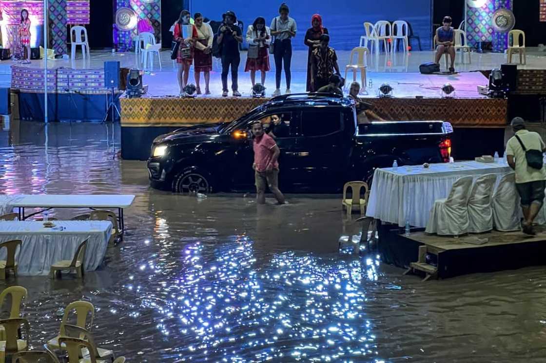 Landslides and flooding kill 13 people and leave seven missing in the southern Philippines Landslides and flooding kill 13 people and leave seven missing in the southern Philippines