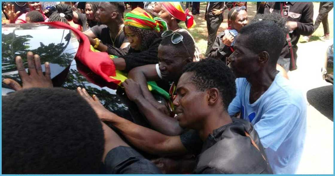 People crying at funeral