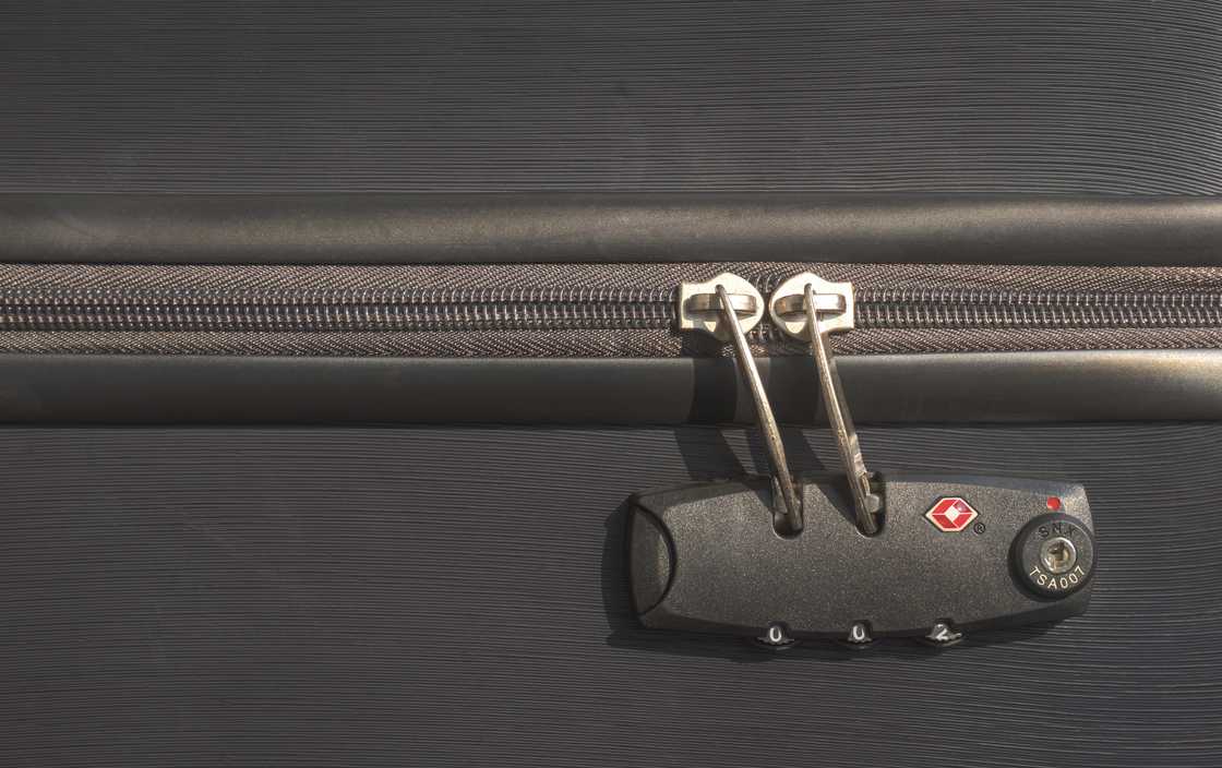 A TSA lock on a luggage bag. A TSA lock on a luggage bag.