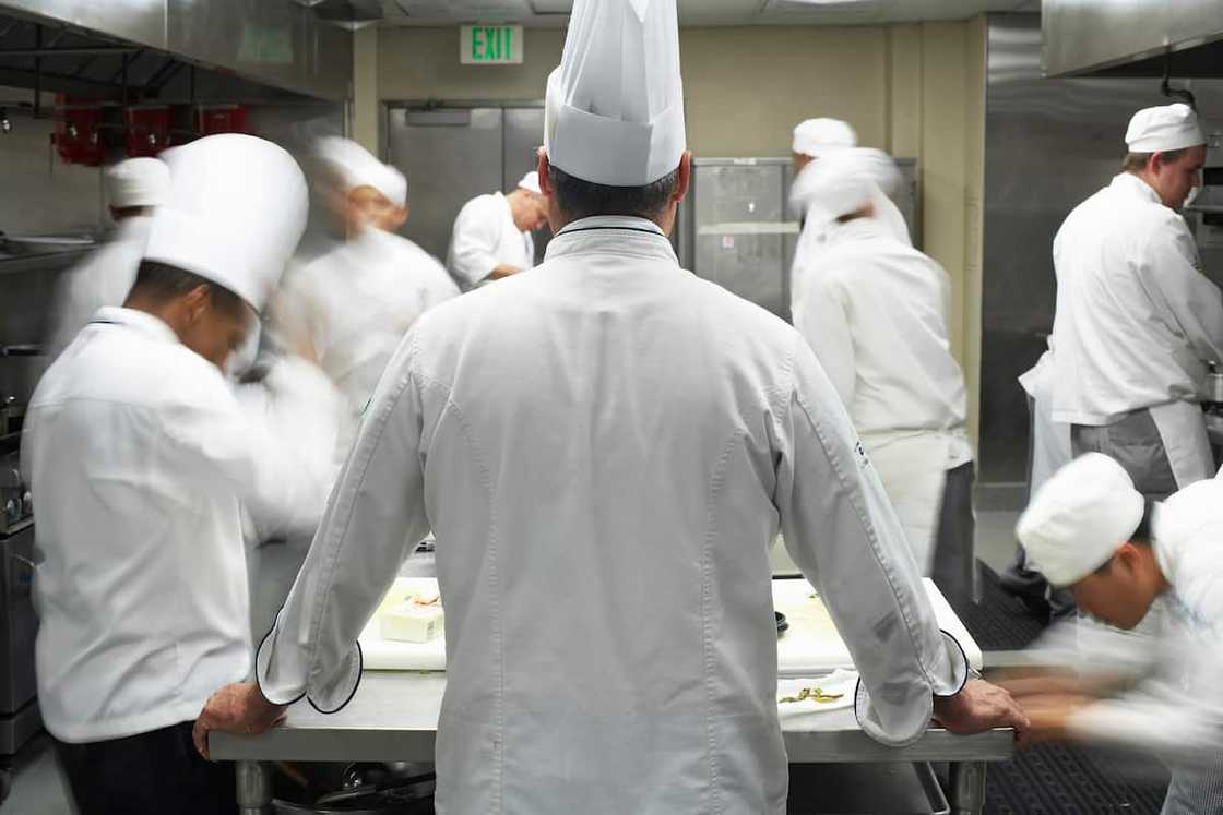 Professional cooks in a commercial kitchen Professional cooks in a commercial kitchen
