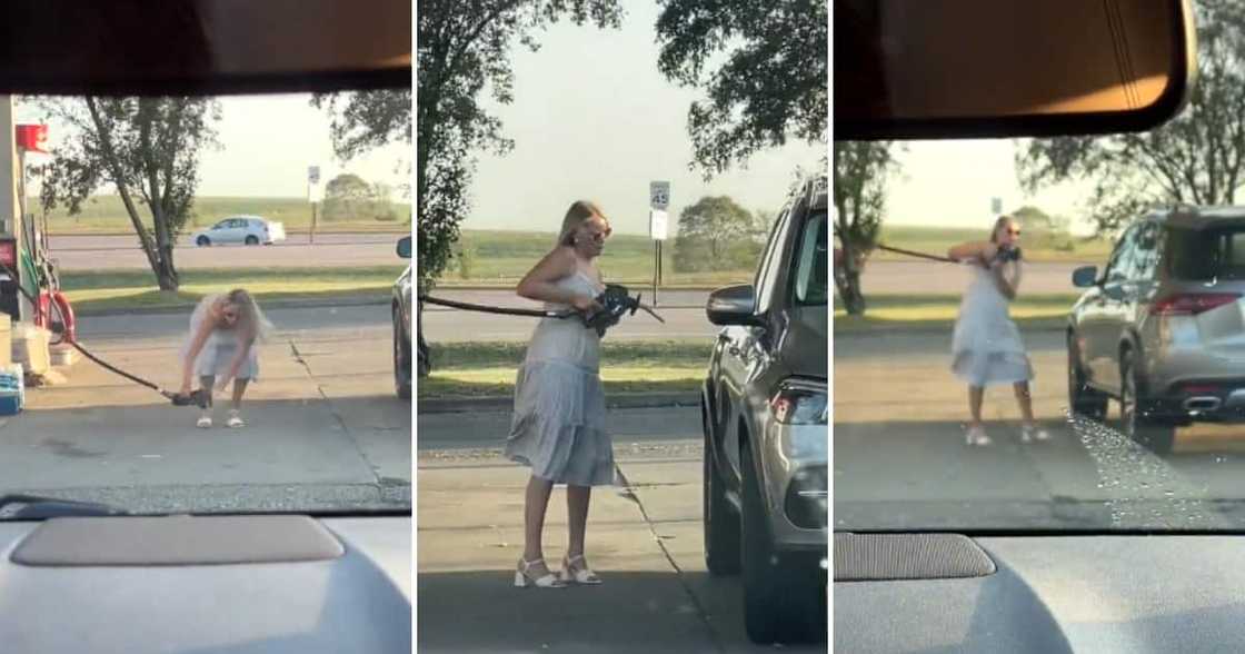 A woman trying to pump fuel but failing A woman trying to pump fuel but failing