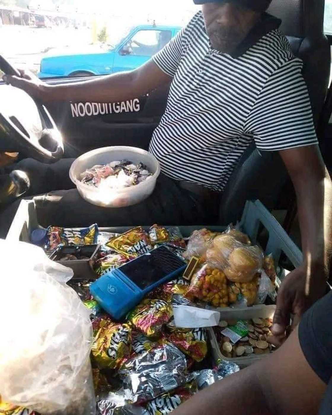A Taxi driver opened a tuckshop in his vehicle. A Taxi driver opened a tuckshop in his vehicle.