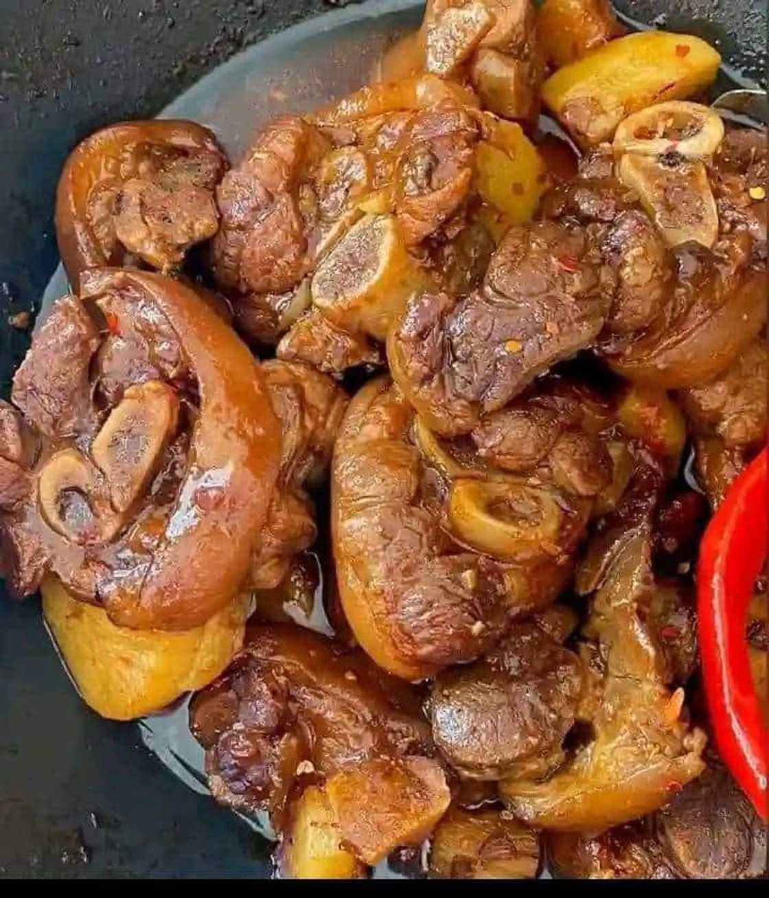 Woman shows off traditional food.