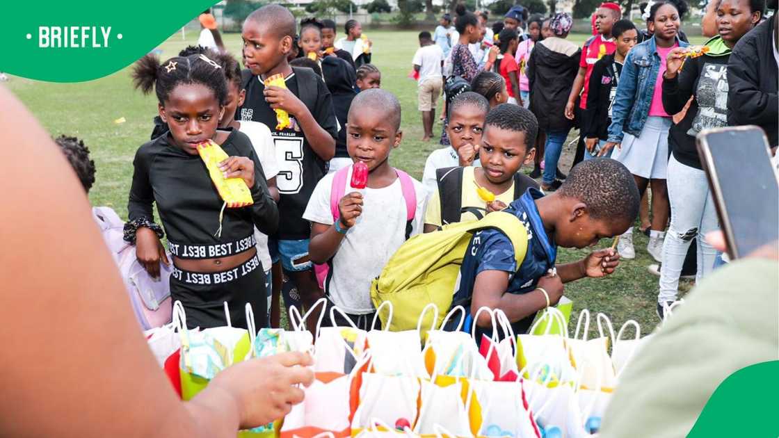 Children line up to receive gifts at the Family Fun Day in Durban Children line up to receive gifts at the Family Fun Day in Durban