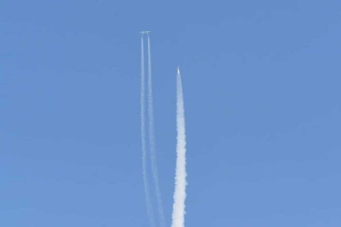 The Virgin Galactic SpaceShipTwo space plane Unity and mothership separate as they fly way above Spaceport America in New Mexico on July 11, 2021