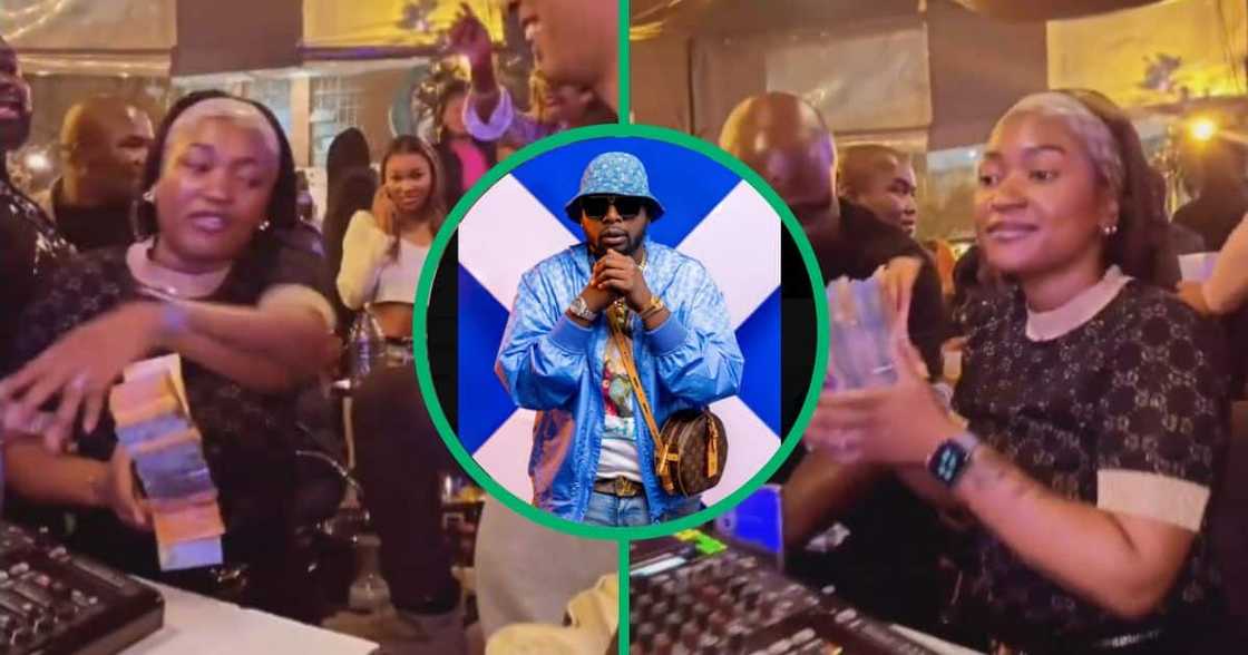 Unknown female throws stacks of money at DJ Maphorisa as tip. Unknown female throws stacks of money at DJ Maphorisa as tip.