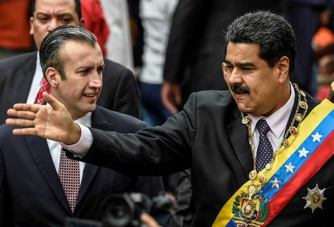 El Aissami (L) was a close ally of President Nicolas Maduro (R), whom he served as vice president El Aissami (L) was a close ally of President Nicolas Maduro (R), whom he served as vice president