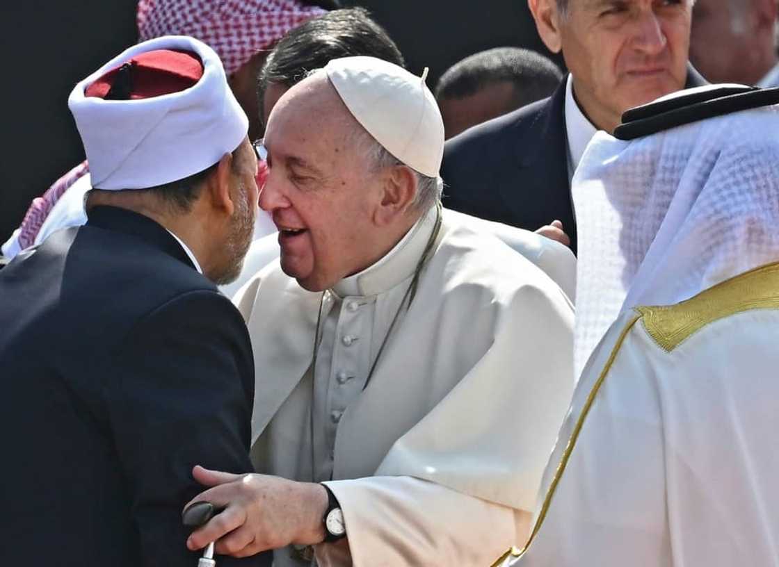 Pope Francis (C) embraced the grand imam of Al-Azhar mosque, Sheikh Ahmed Al-Tayeb Pope Francis (C) embraced the grand imam of Al-Azhar mosque, Sheikh Ahmed Al-Tayeb