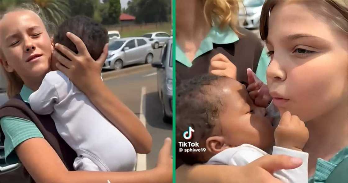 A group of school kids marvelled at a black baby A group of school kids marvelled at a black baby