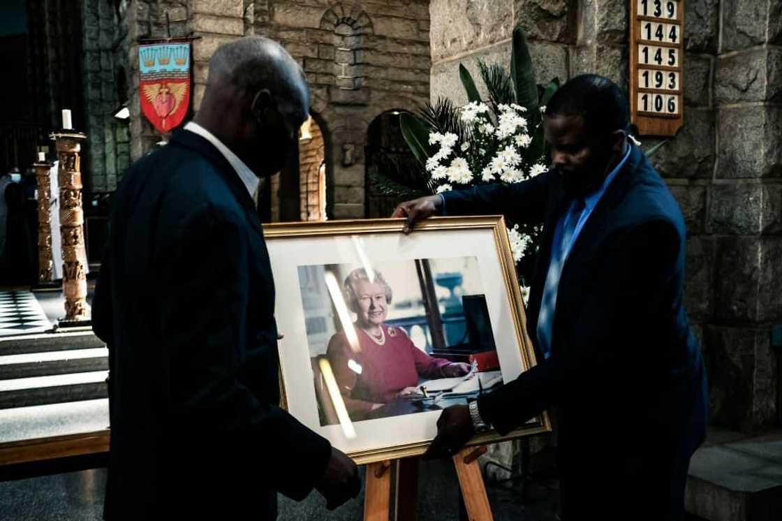 A portrait of the queen is placed on a stand ahead of a thanksgiving service at the Anglican Cathedral A portrait of the queen is placed on a stand ahead of a thanksgiving service at the Anglican Cathedral
