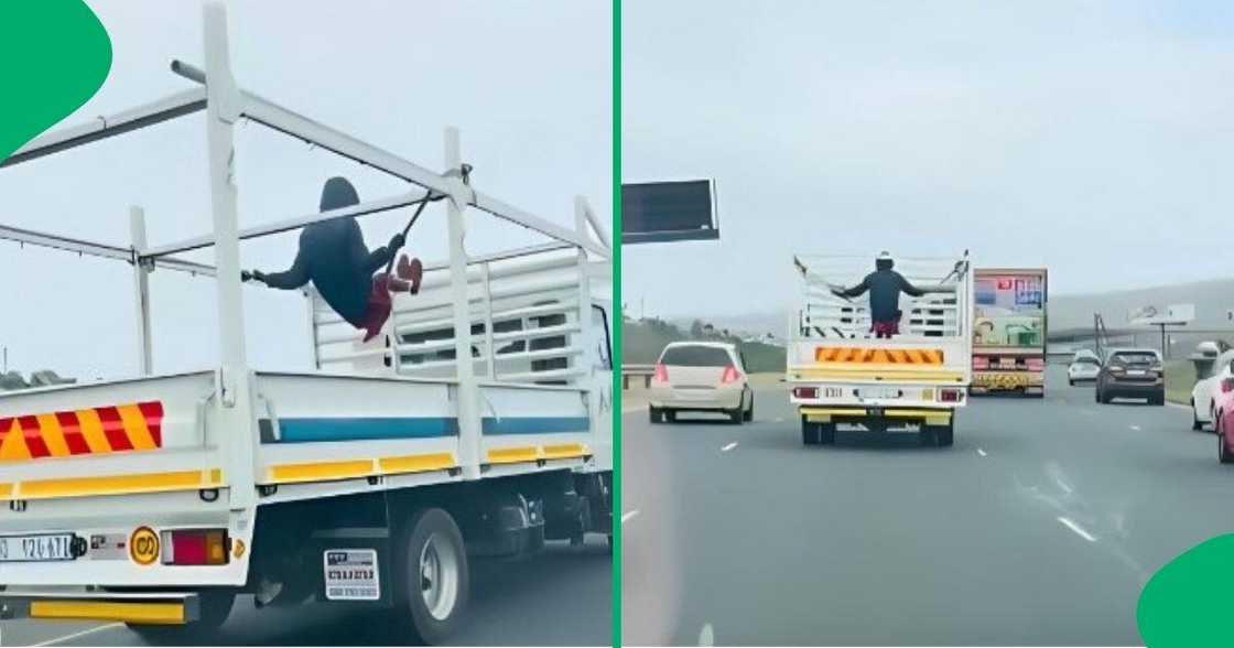 KwaZulu-Natal man swings on the back of a truck on a highway. KwaZulu-Natal man swings on the back of a truck on a highway.