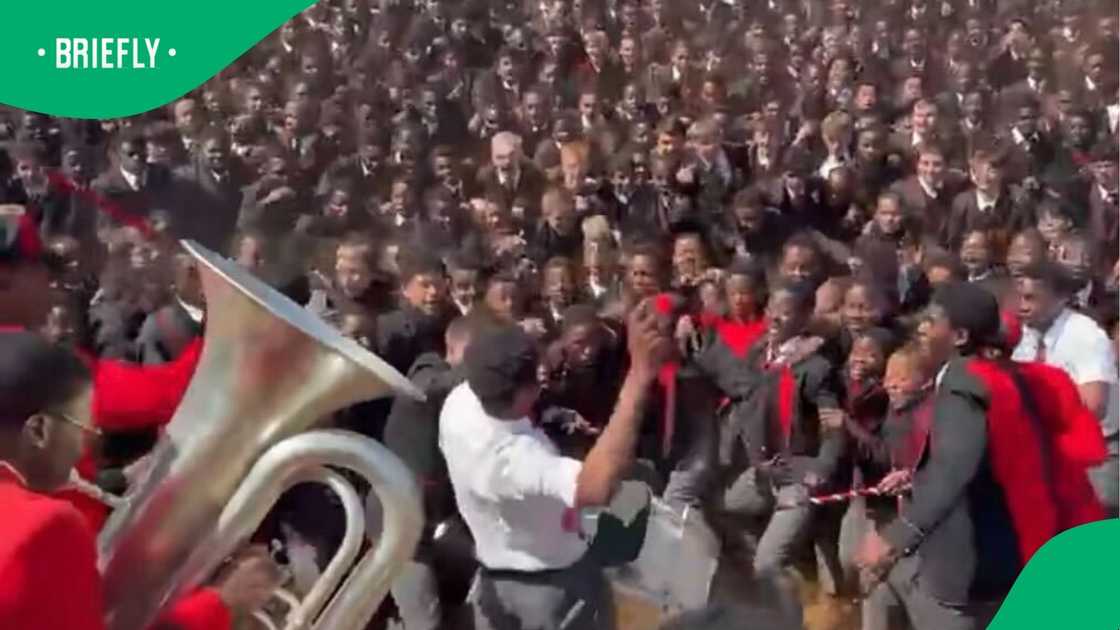 A group of high school boys performed an impressive war cry. A group of high school boys performed an impressive war cry.