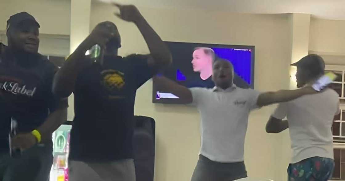 South African men were recorded singing and dancing at the bar South African men were recorded singing and dancing at the bar